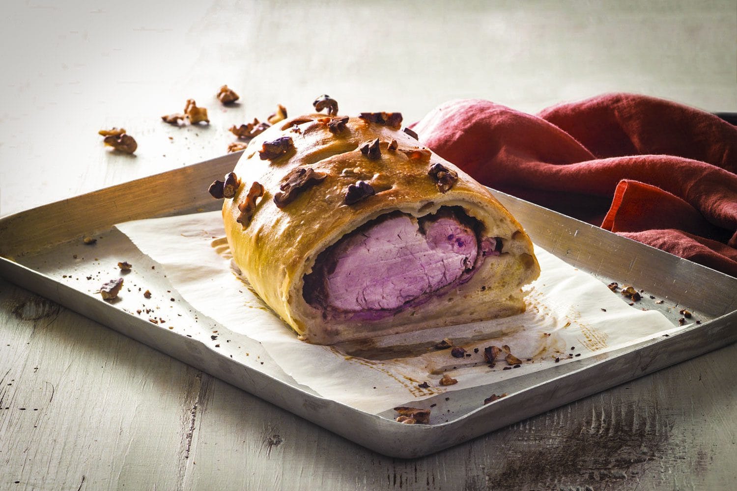 Ricetta per Filetto di maiale avvolto nel pane alle noci
